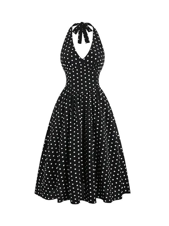 Black halter-neck midi dress with white polka dots, photographed flat on a white background.