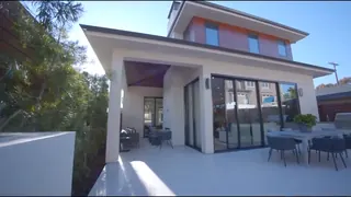 Still from the tour: rear exterior and alfresco terrace.